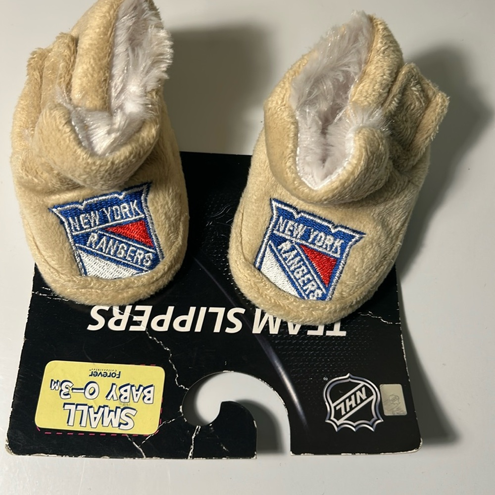 Brand new official nhl rangers baby booties 
O-3 months
